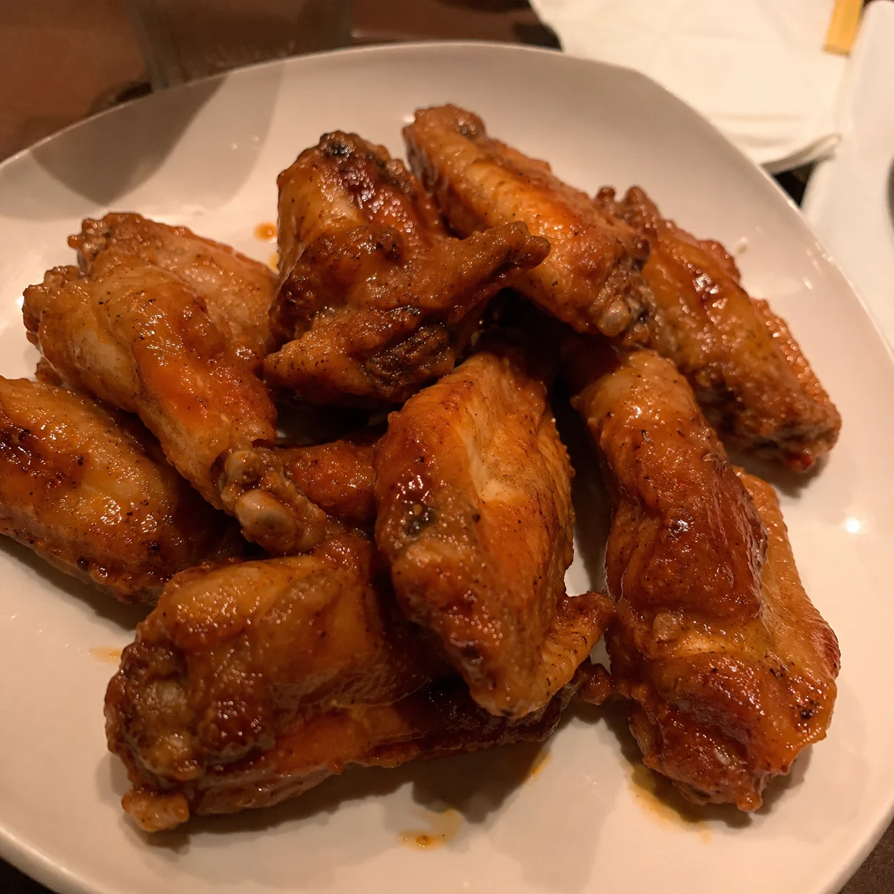 Original phone photo of wings before enhancement for Uber Eats