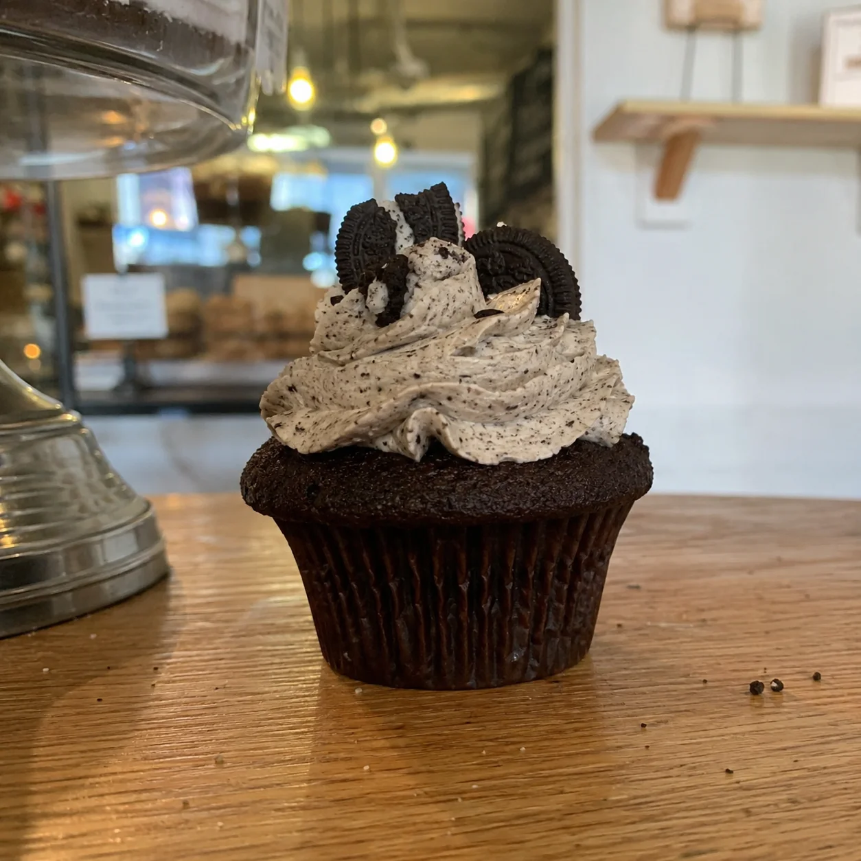 Original phone photo of a decorated cupcake before enhancement for Instagram